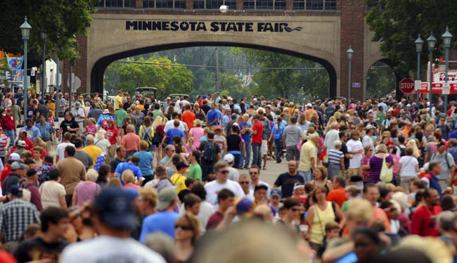 A large crowd walked along Liggett Street on the opening day of the Minnesota State Fair in Falcon Heights, Thursday, August 23, 2012. (Pioneer Press: Chris Polydoroff)