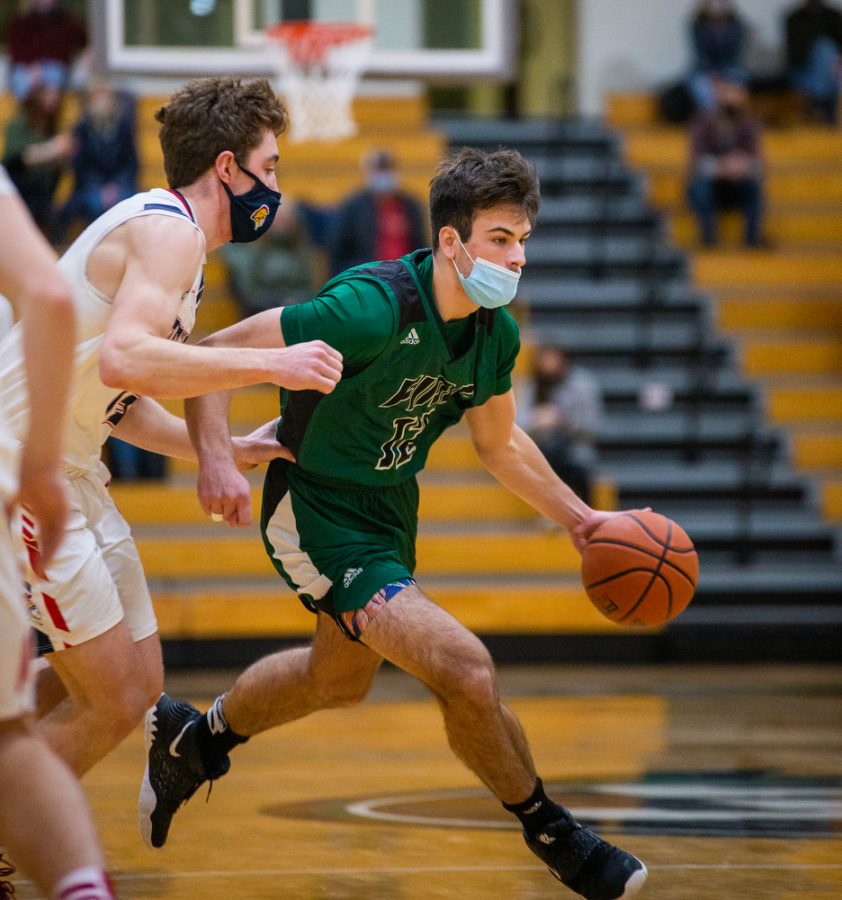 Holy Family’s Jake Kirsch 21 (12) during a basketball game versus Orono. The Fire lost the game 82-62 on Friday, January 29, 2021 at Holy Family Catholic High School.